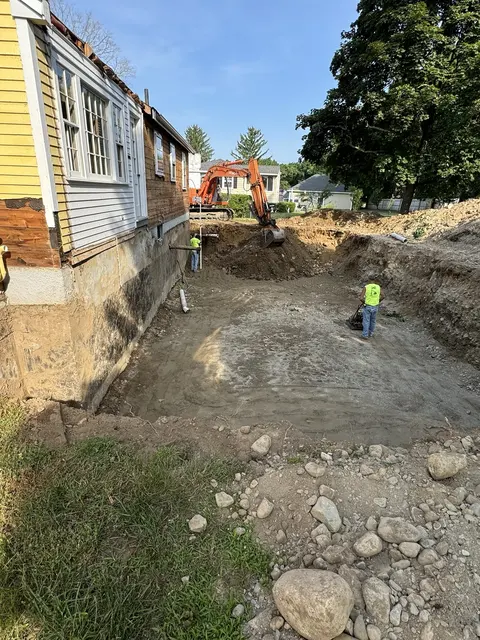 Excavation for the addition next to the house.