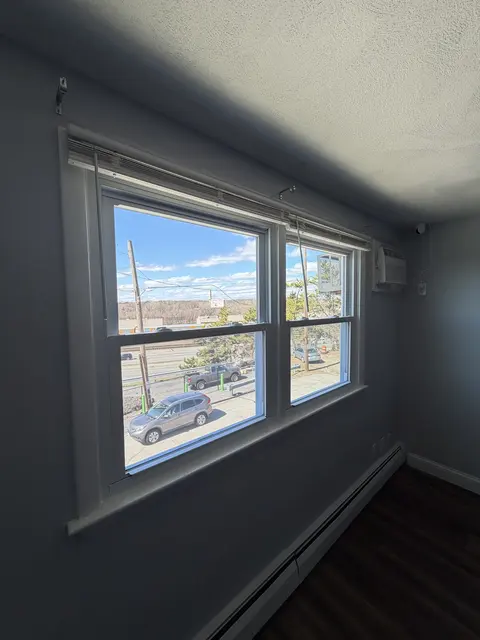 New white windows in a bedroom.