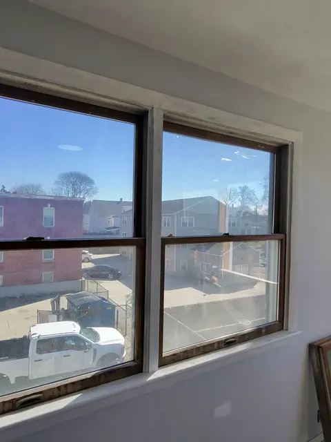 A pair of old dark-framed windows.